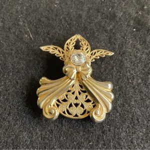 Cute little gold angel pin. 1/2” crystal for her face/head. Total length is 2”